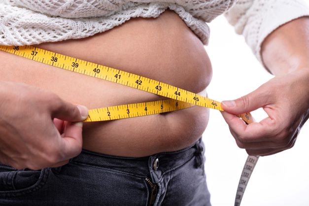 measuring body to determine waistline and manage weight gain