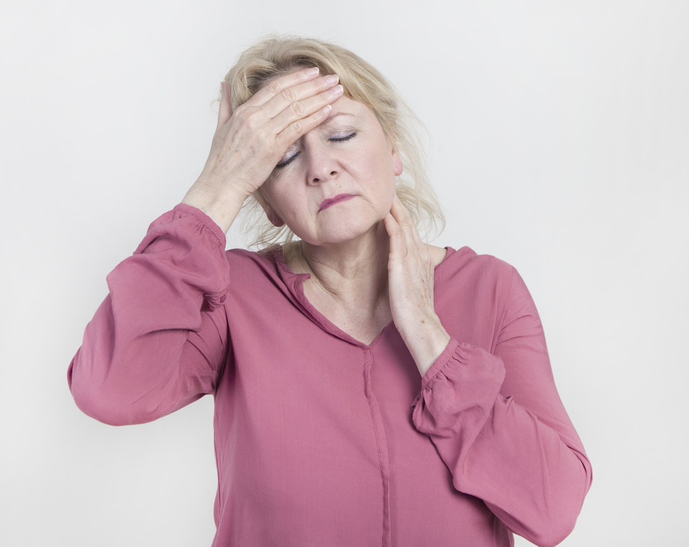 Older women experiencing severe headaches.