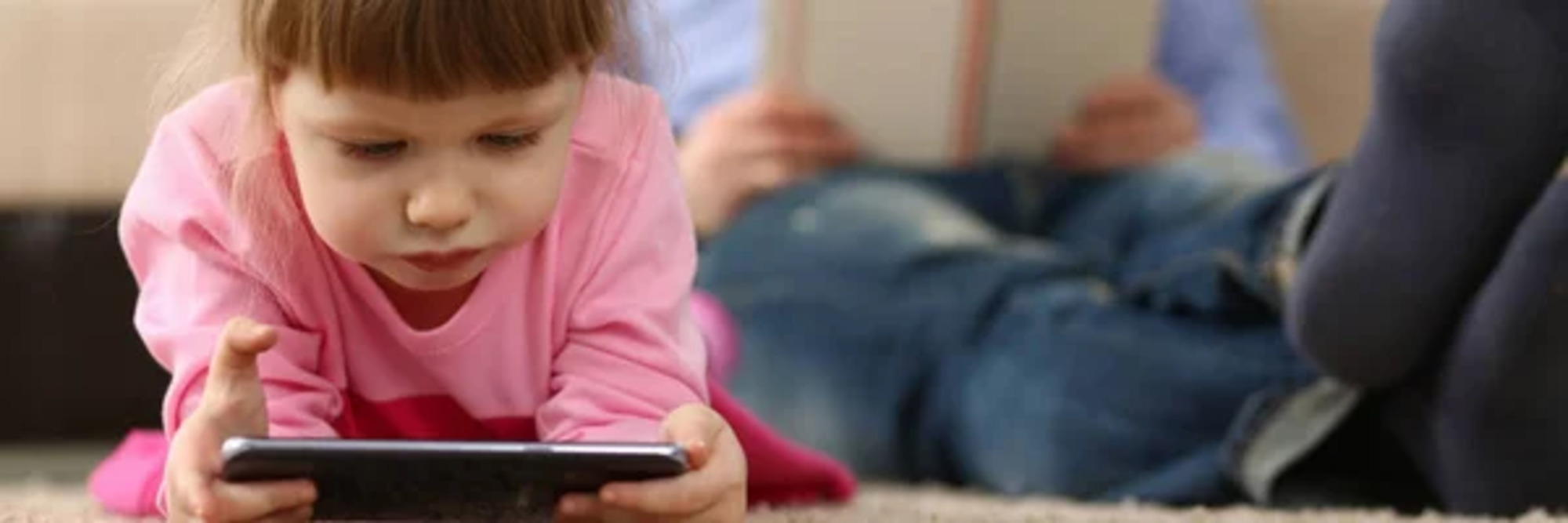 Little girl using mobile phone.