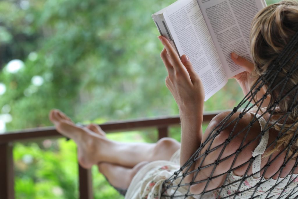 Woman reading book.