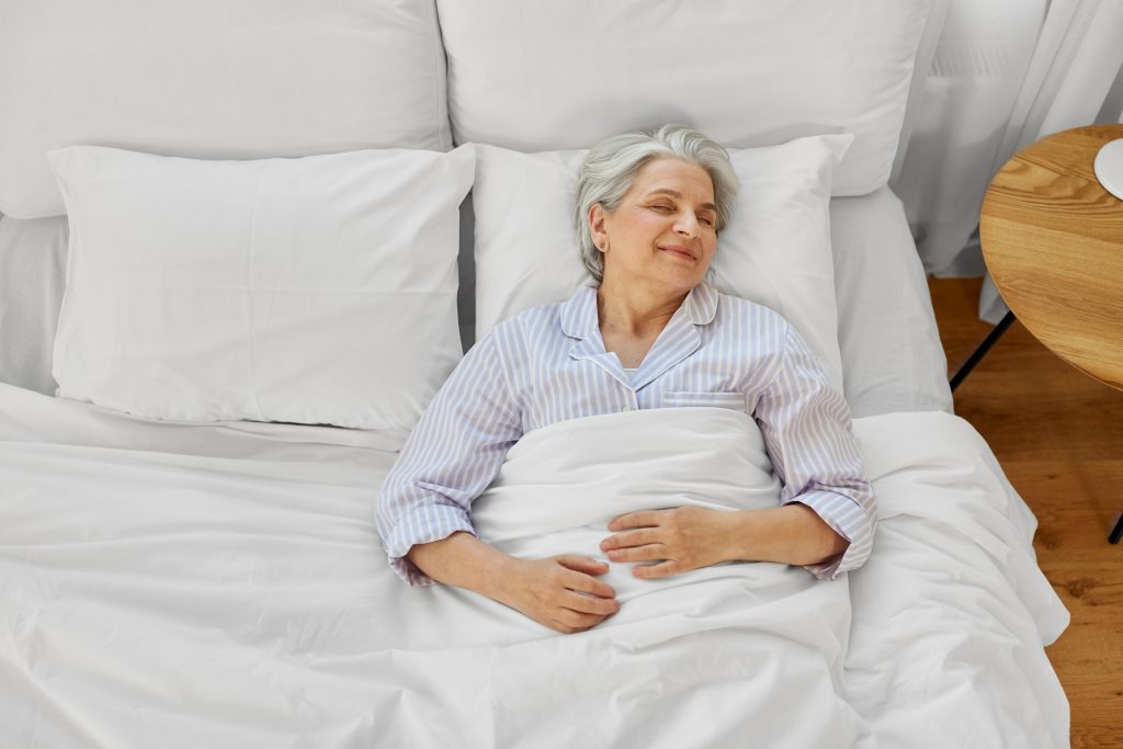 Elderly woman sleeping peacefully.