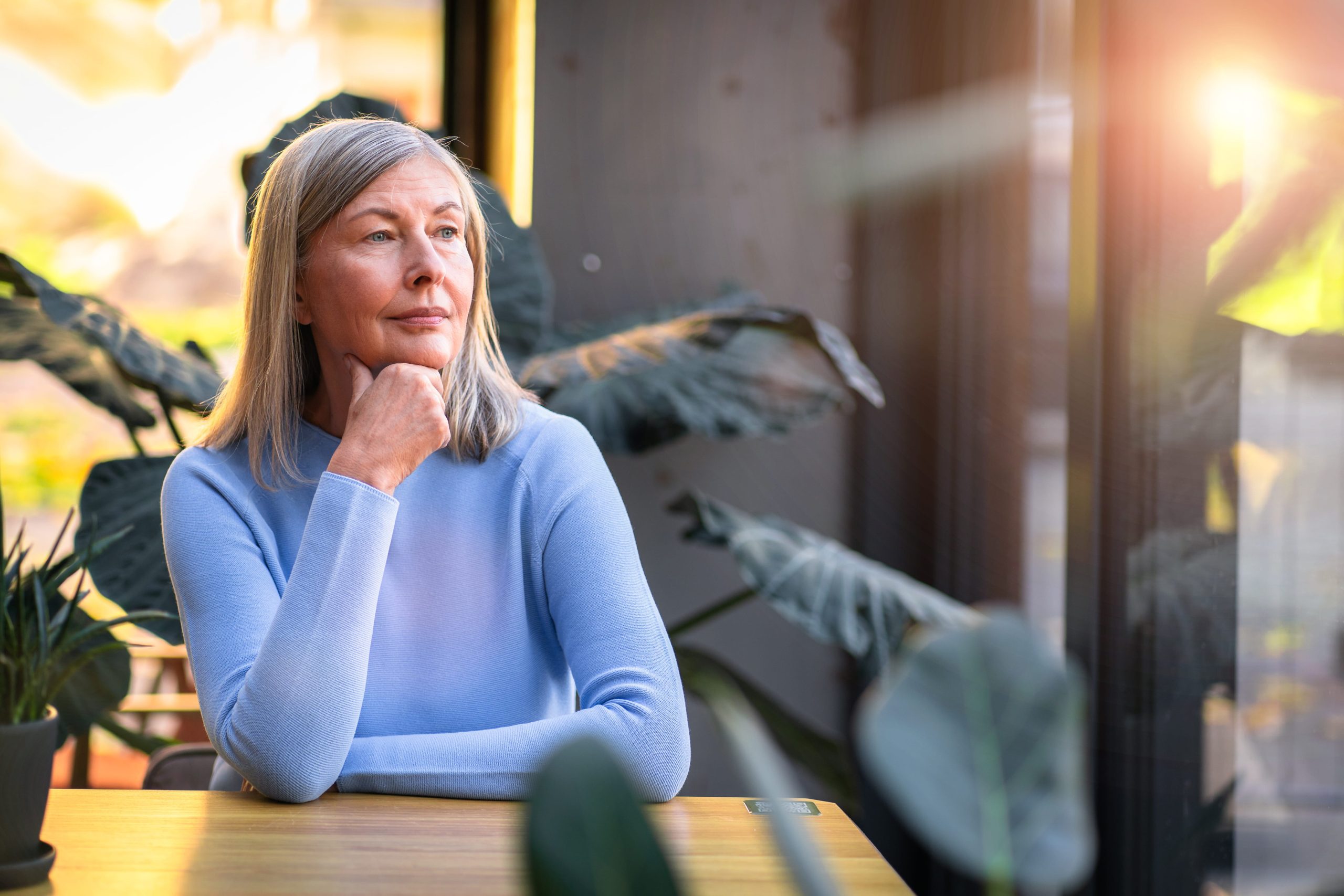 Senior woman doing self-reflection questions to ease midlife.