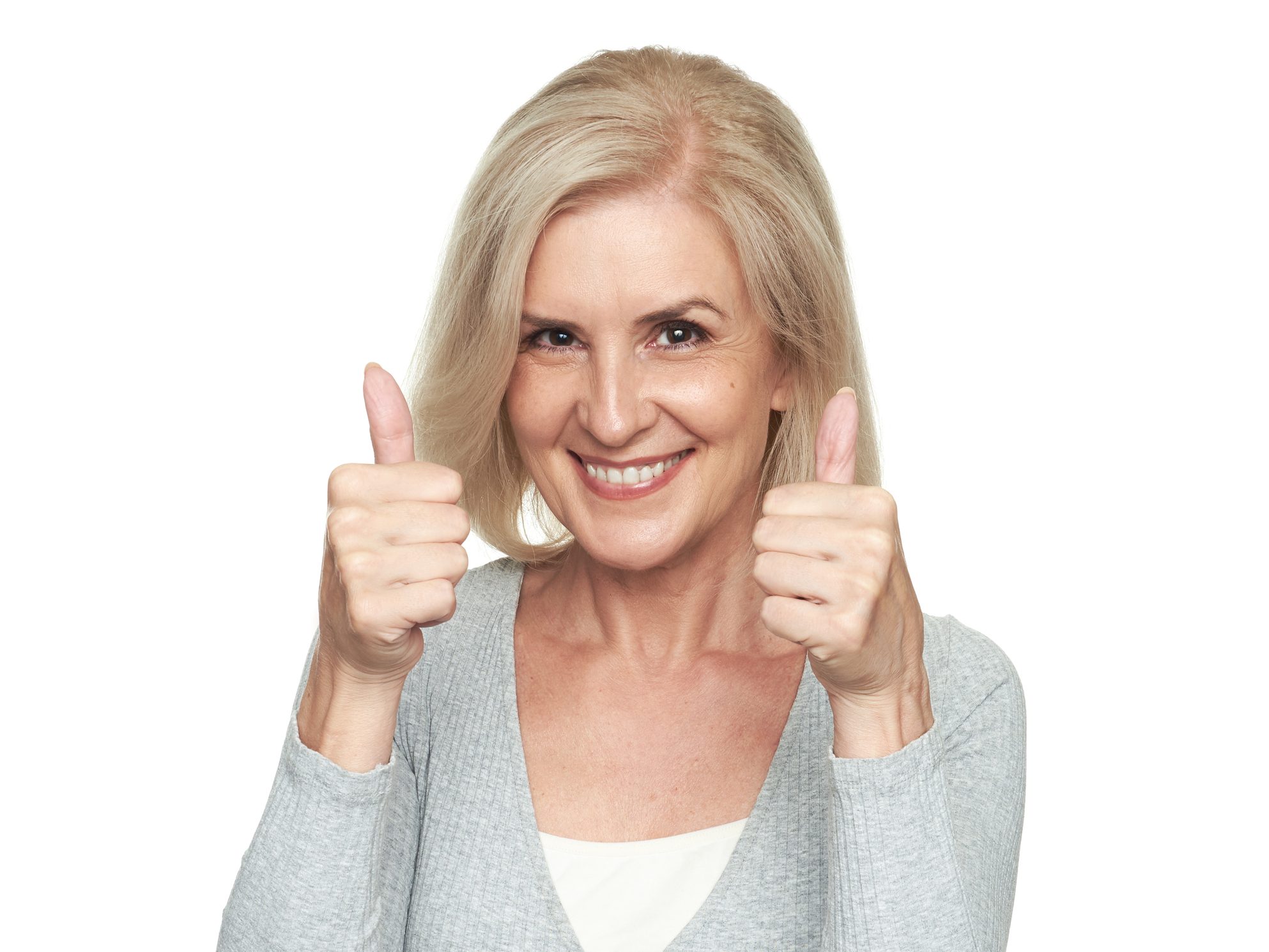 Middle aged blonde woman smiling.