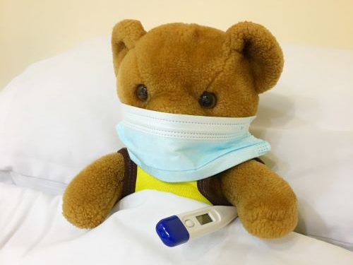 A sick stuffed toy representing what is cough.