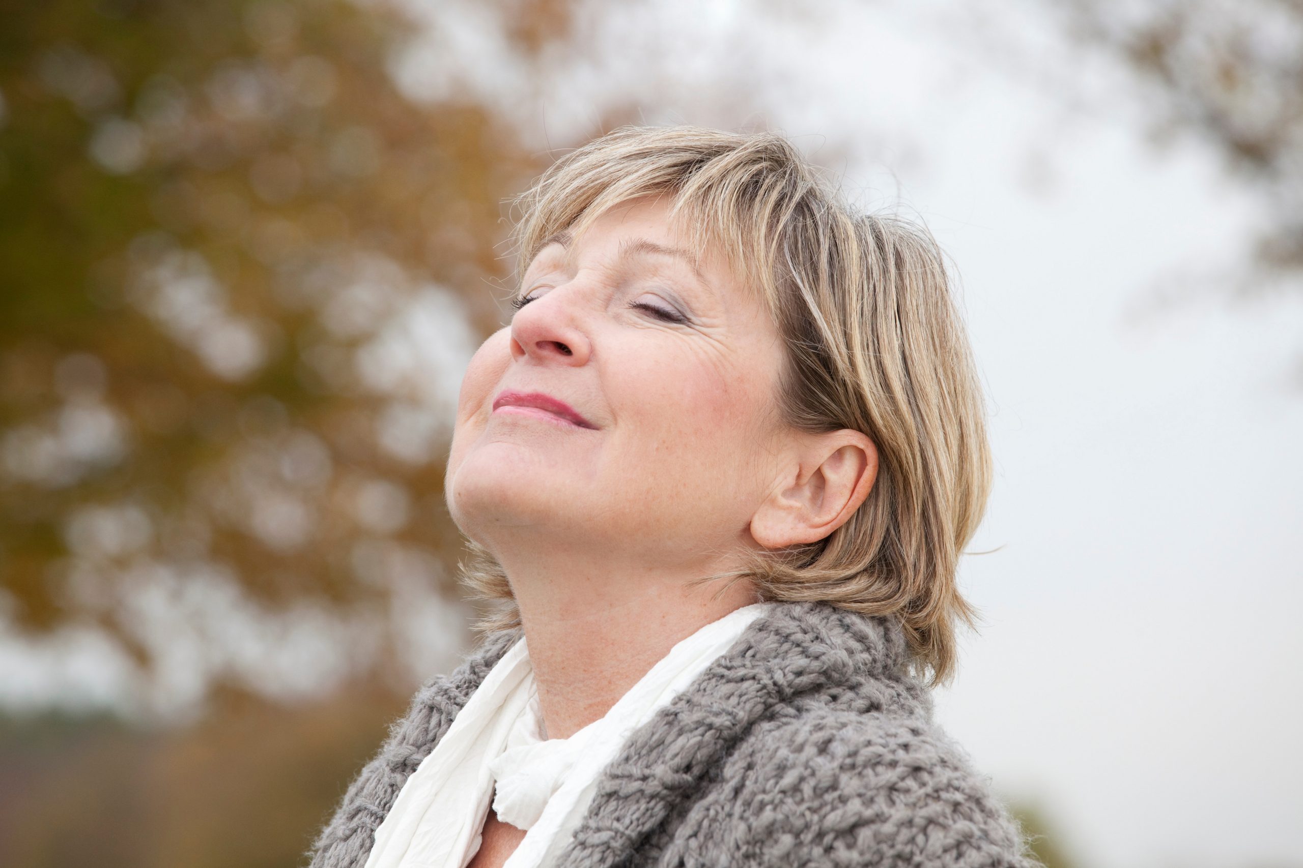 Woman breathing air outdoors to ease perimenopause rage