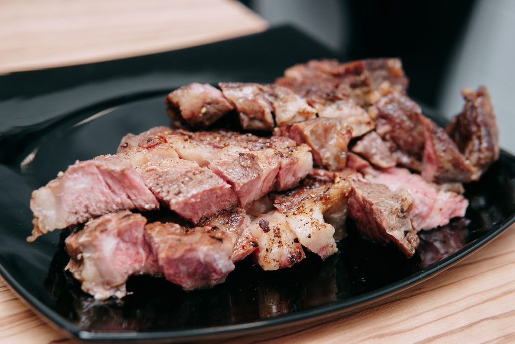 Plain plate of cooked meat with no vegetables, representing the carnivore diet side effects that build slowly
